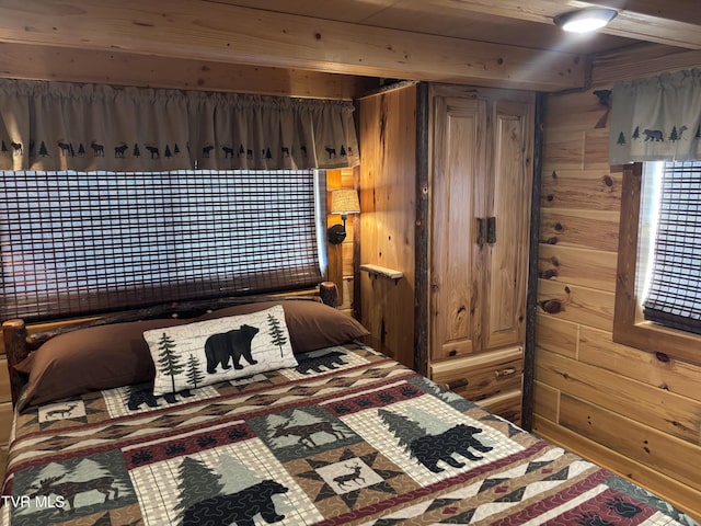 bedroom with wooden walls