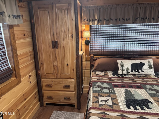 bedroom featuring dark hardwood / wood-style flooring