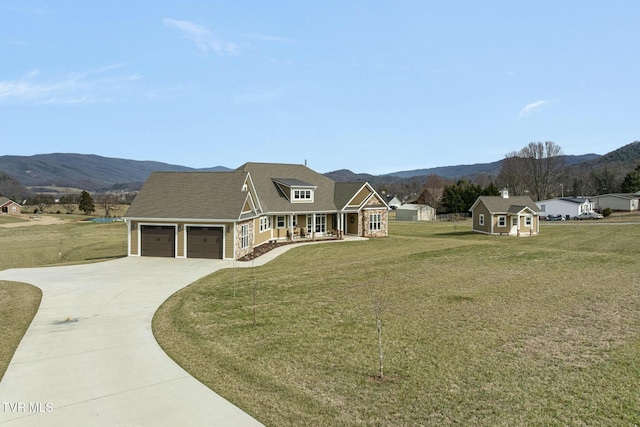 132 Hamilton Rd, Elizabethton, TN 37643 - view of front of property featuring a porch, a garage, a shed, a mountain view, and a front lawn