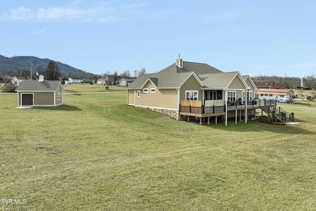 132 Hamilton Rd, Elizabethton, TN 37643 - view of yard featuring a garage, an outdoor structure, and a deck with mountain view