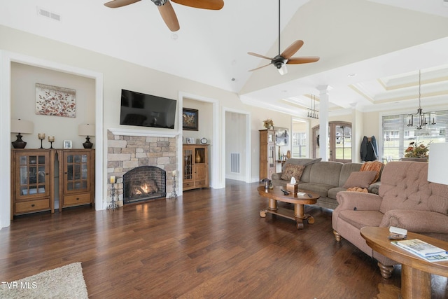 132 Hamilton Rd, Elizabethton, TN 37643 - living room featuring dark hardwood / wood-style floors, a fireplace, ceiling fan with notable chandelier, a raised ceiling, and ornate columns
