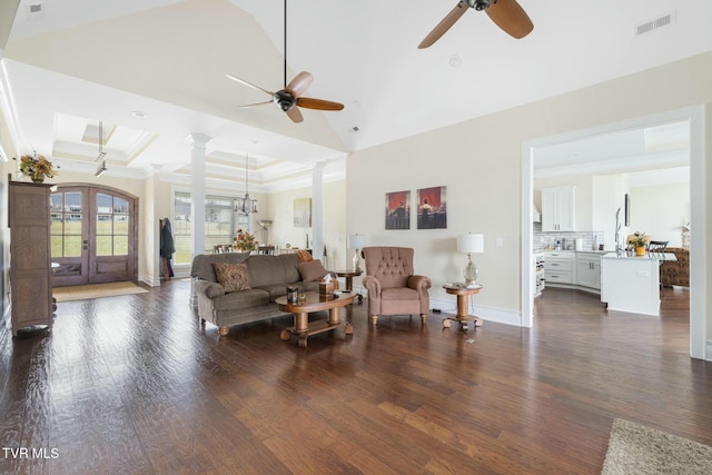 132 Hamilton Rd, Elizabethton, TN 37643 - living room featuring ceiling fan with notable chandelier, dark wood-type flooring, french doors, and ornate columns