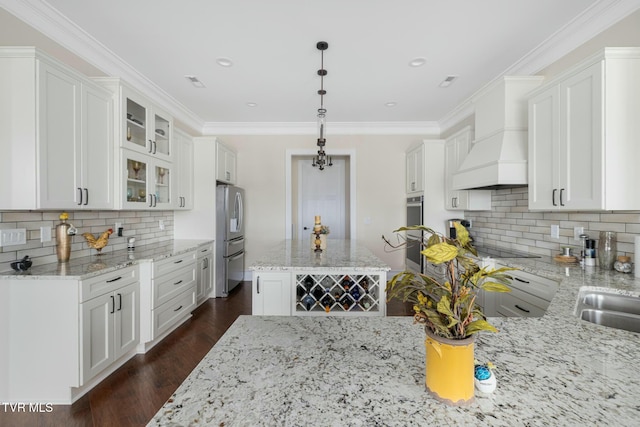 132 Hamilton Rd, Elizabethton, TN 37643 - kitchen featuring stainless steel refrigerator, white cabinetry, decorative light fixtures, and custom exhaust hood