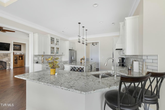 132 Hamilton Rd, Elizabethton, TN 37643 - kitchen featuring stainless steel refrigerator with ice dispenser, sink, white cabinets, and kitchen peninsula