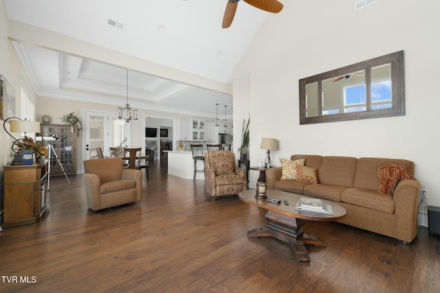 132 Hamilton Rd, Elizabethton, TN 37643 - living room with ceiling fan with notable chandelier, dark wood-type flooring, ornamental molding, and a raised ceiling