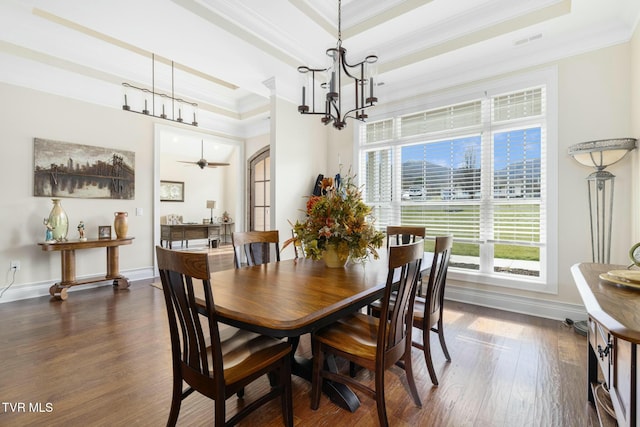 132 Hamilton Rd, Elizabethton, TN 37643 - dining area featuring dark hardwood / wood-style flooring, a tray ceiling, ceiling fan with notable chandelier, and ornamental molding