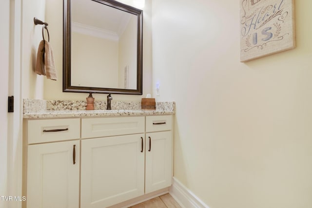 132 Hamilton Rd, Elizabethton, TN 37643 - bathroom with ornamental molding, vanity, and hardwood / wood-style floors