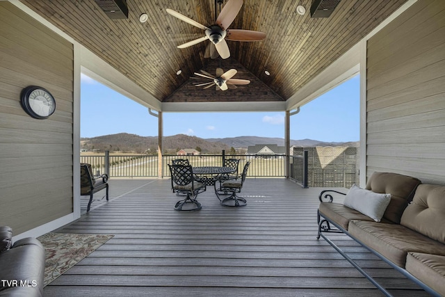 132 Hamilton Rd, Elizabethton, TN 37643 - wooden deck featuring ceiling fan, an outdoor living space, and a mountain view