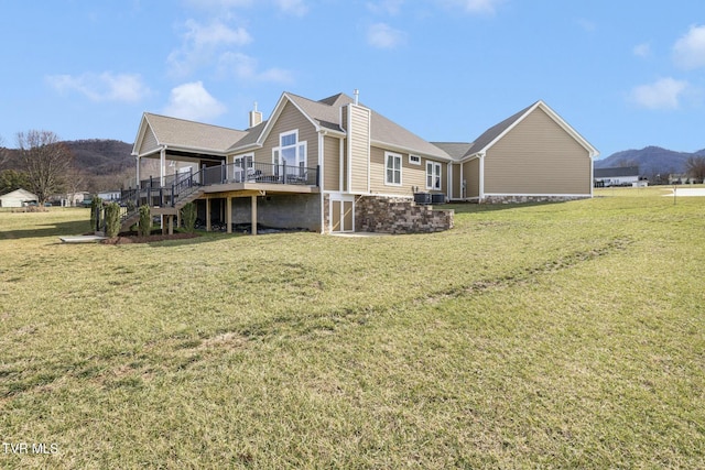 132 Hamilton Rd, Elizabethton, TN 37643 - rear view of house featuring cooling unit, a lawn, and a deck with mountain view