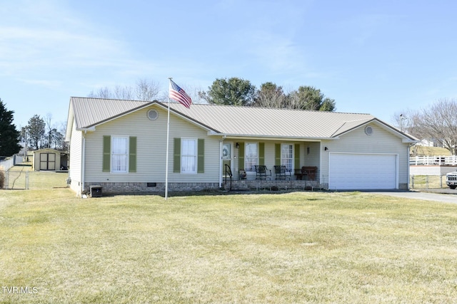 ranch-style house with a porch, a garage, a front yard, and a shed