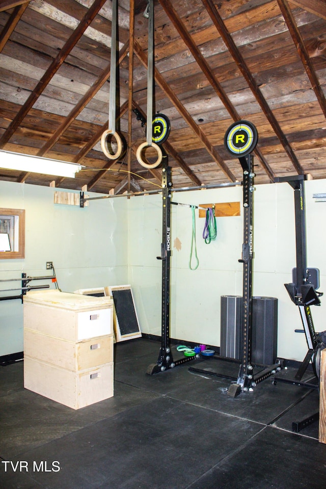 workout room featuring lofted ceiling and wooden ceiling