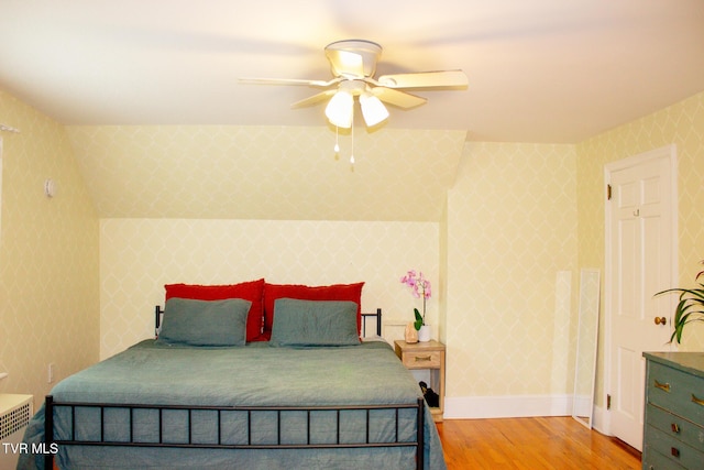 bedroom with ceiling fan and light hardwood / wood-style flooring