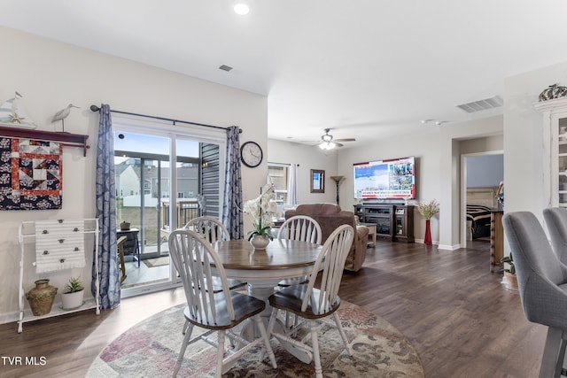 dining area featuring dark hardwood / wood-style floors and ceiling fan