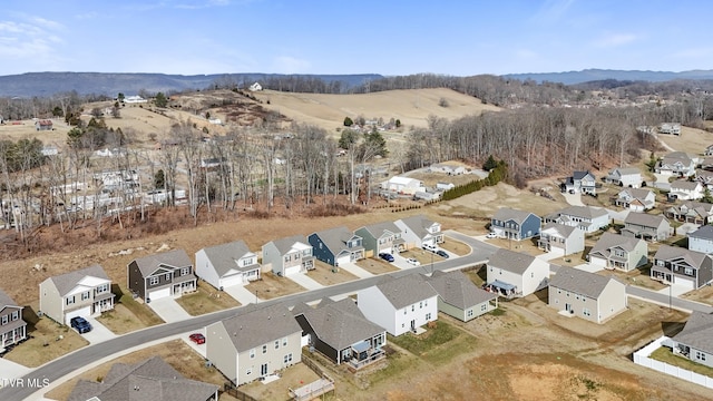 birds eye view of property with a mountain view