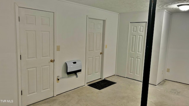 interior space featuring a textured ceiling