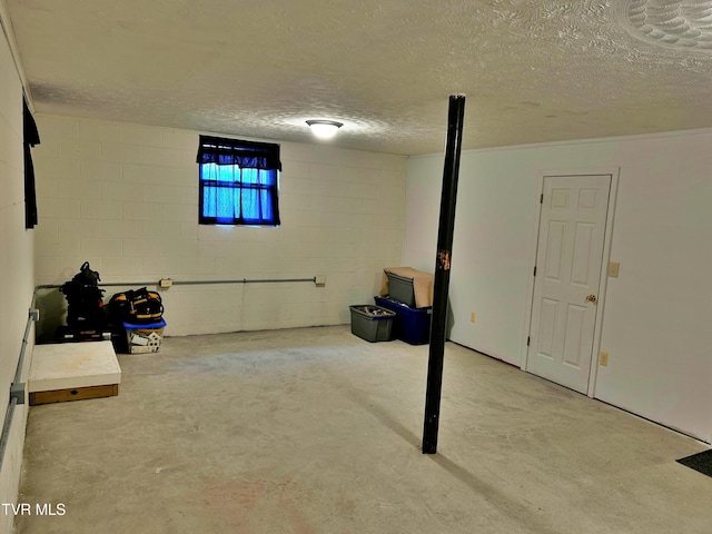 basement featuring a textured ceiling