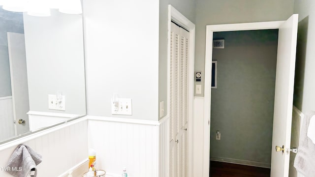 bathroom with hardwood / wood-style flooring