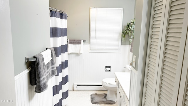 bathroom featuring a baseboard radiator, walk in shower, vanity, and toilet