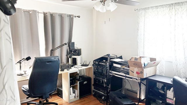 office area with hardwood / wood-style floors and ceiling fan