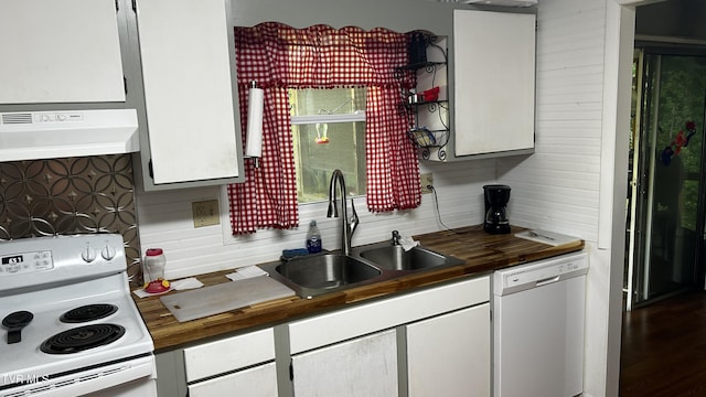 kitchen with white appliances, sink, and white cabinets