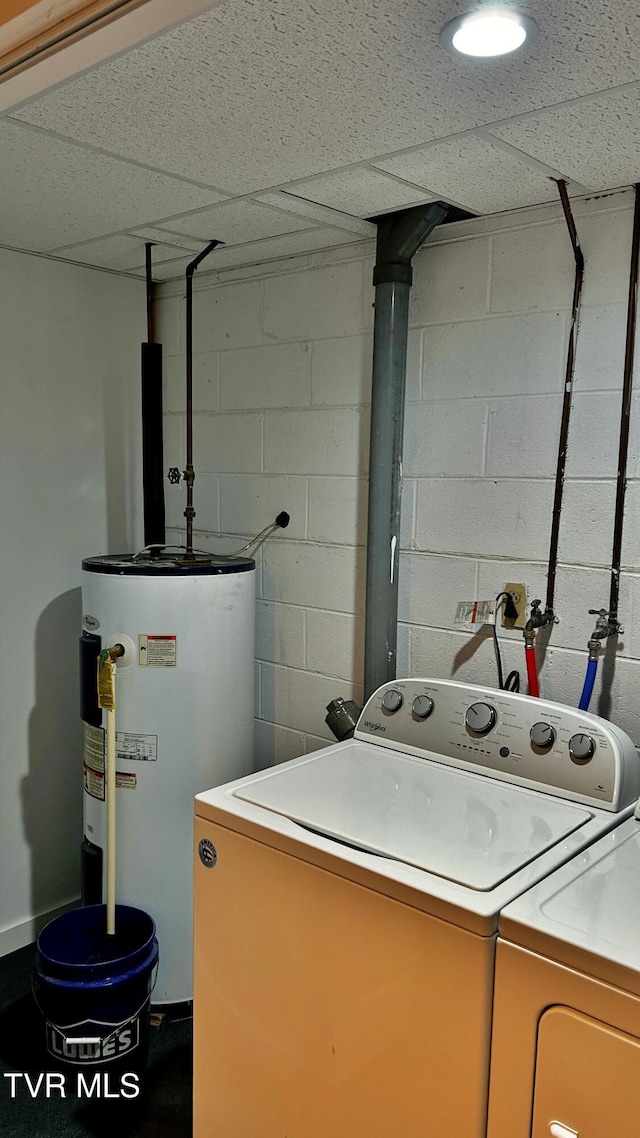 washroom with washer and clothes dryer and water heater