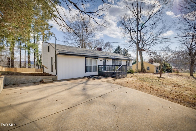 view of front of house with a wooden deck