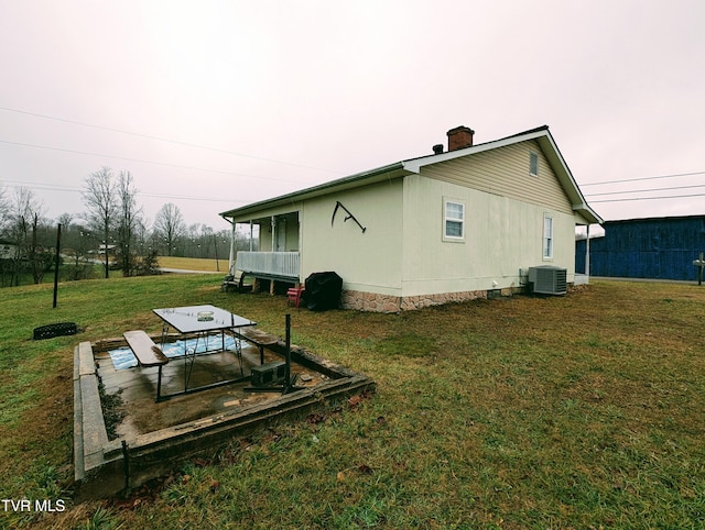 view of property exterior featuring a yard and cooling unit