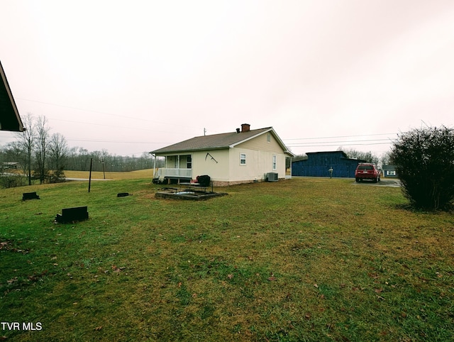 view of yard with central AC