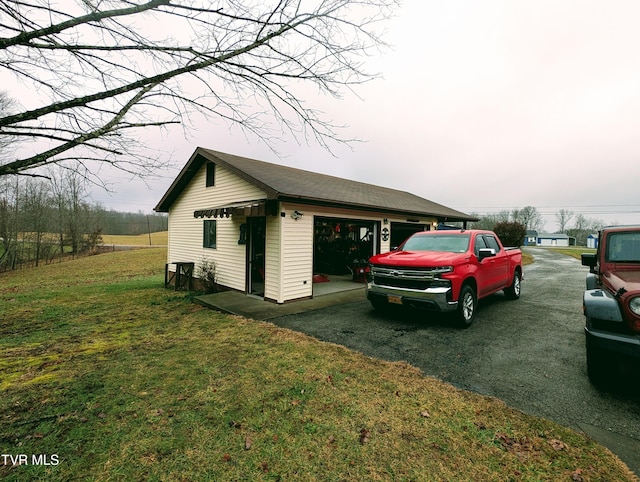 view of side of home featuring a yard