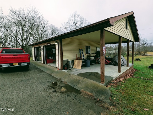 view of property exterior with a garage and a carport