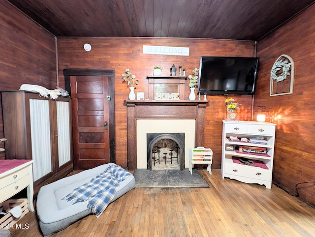 living room with hardwood / wood-style floors and wood ceiling