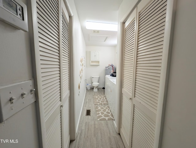 hallway with light hardwood / wood-style flooring