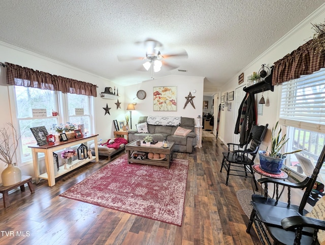 living room with vaulted ceiling, dark hardwood / wood-style floors, ceiling fan, crown molding, and a textured ceiling