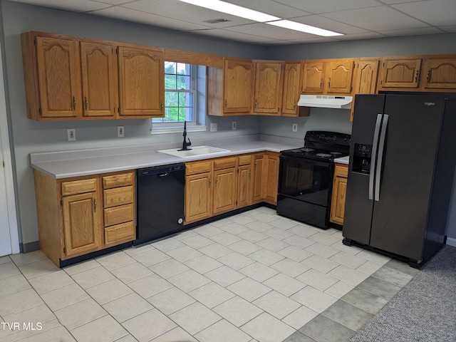 kitchen featuring a drop ceiling, sink, and black appliances