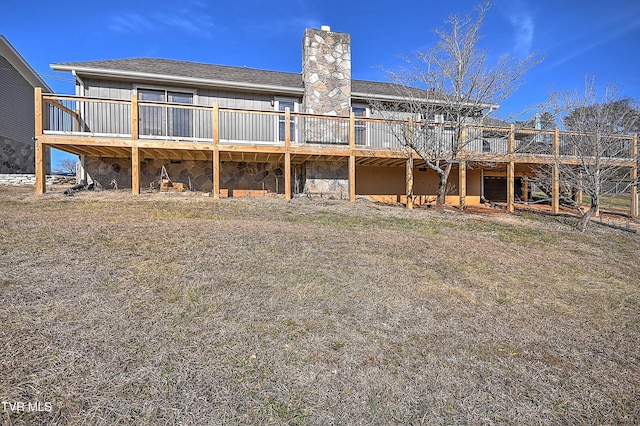 back of property with a wooden deck