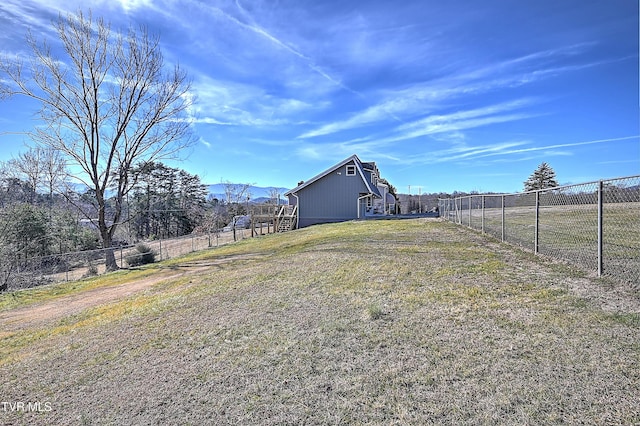 view of yard with a rural view