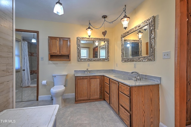 bathroom featuring tile patterned floors, vanity, toilet, and a shower with shower curtain