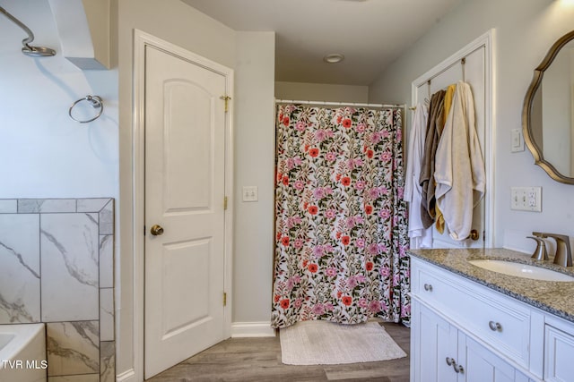 bathroom with vanity, a shower with curtain, and wood-type flooring