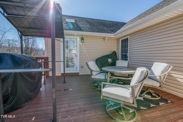 wooden deck featuring area for grilling