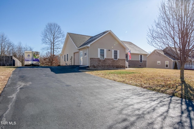 view of front of property with a garage and a front yard