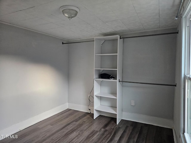 unfurnished bedroom with dark hardwood / wood-style flooring