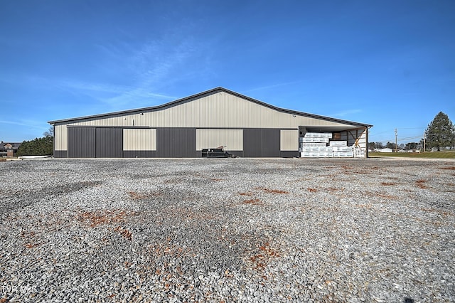 view of property exterior with an outbuilding