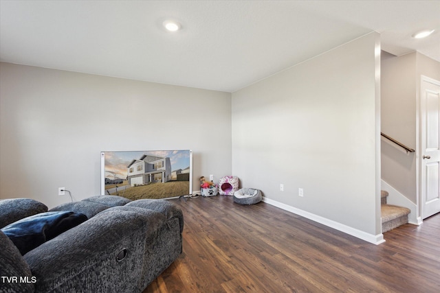 living area with dark hardwood / wood-style flooring