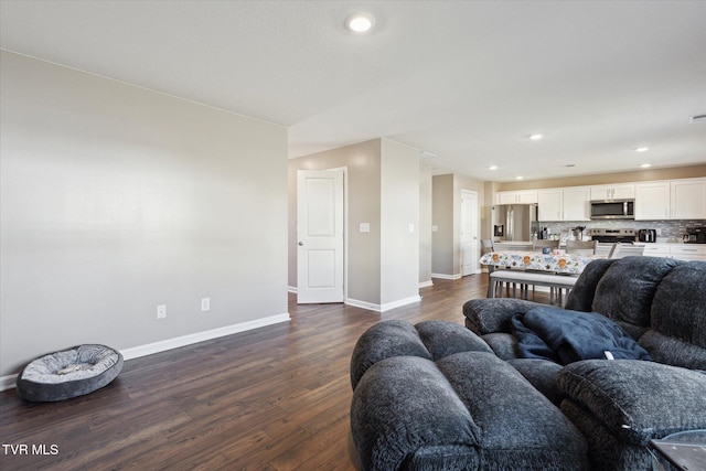 living room featuring dark wood-type flooring