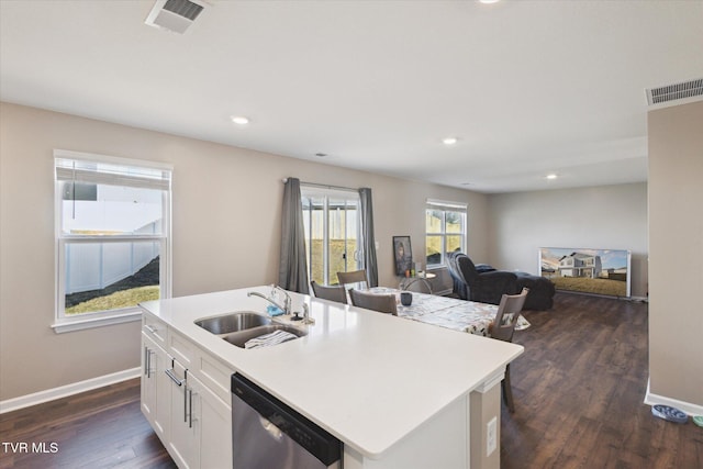 kitchen featuring white cabinets, sink, stainless steel dishwasher, and a kitchen island with sink