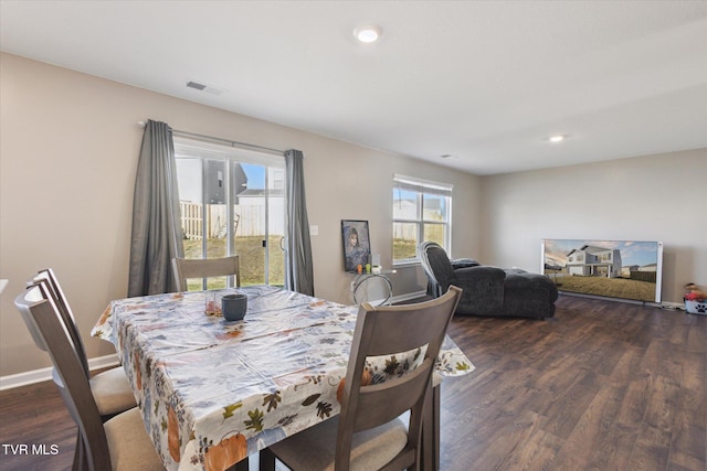 dining room featuring dark hardwood / wood-style flooring