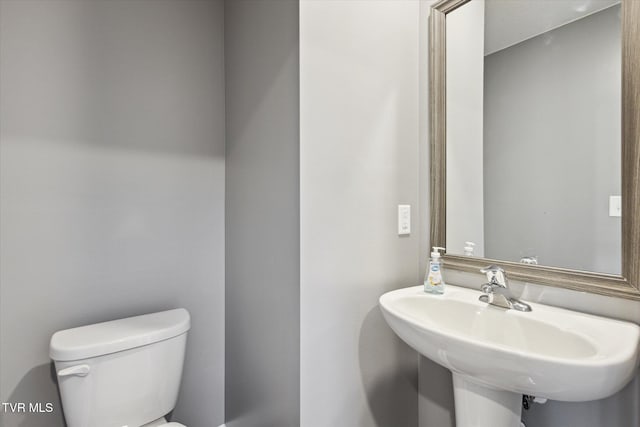 bathroom with sink and toilet