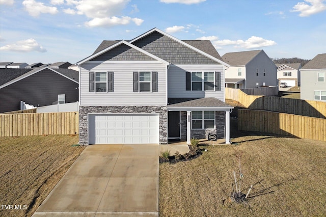 view of front of home featuring a garage and a front yard