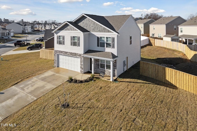 view of front facade featuring a garage and a front lawn