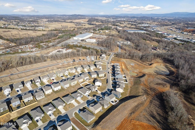 birds eye view of property with a mountain view